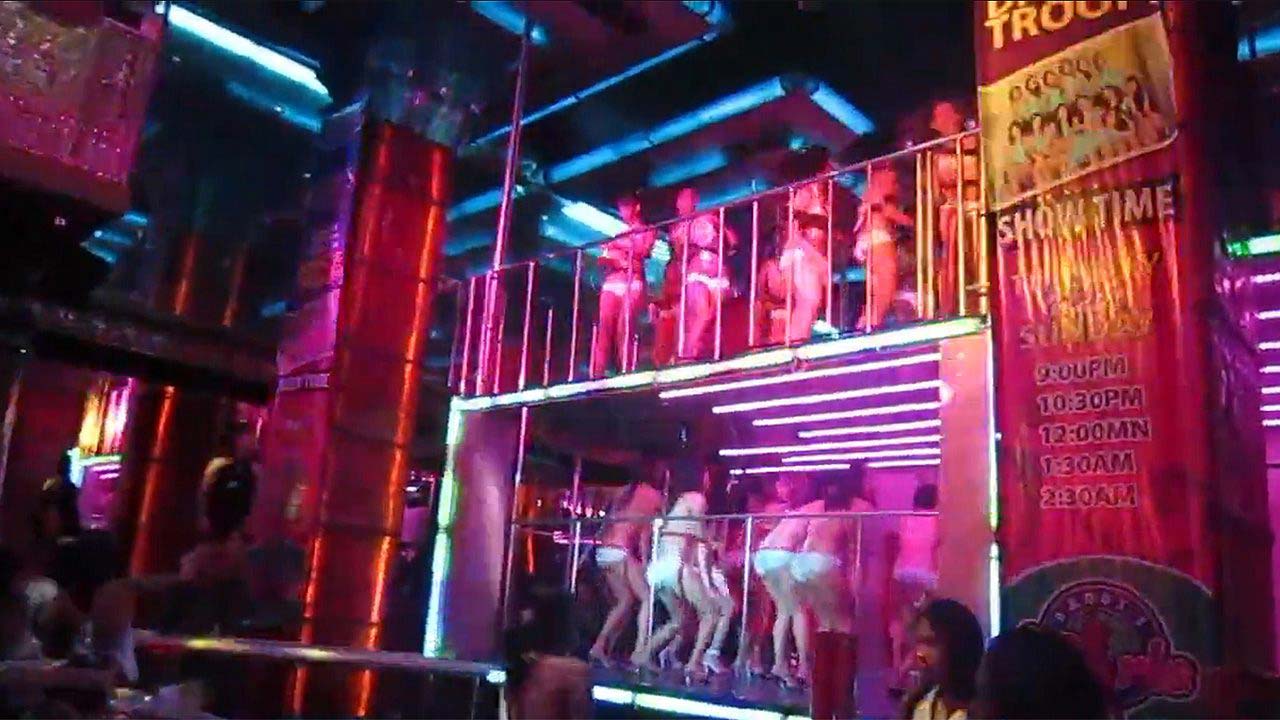 Stage Sluts dancing to music inside Fields Ave club