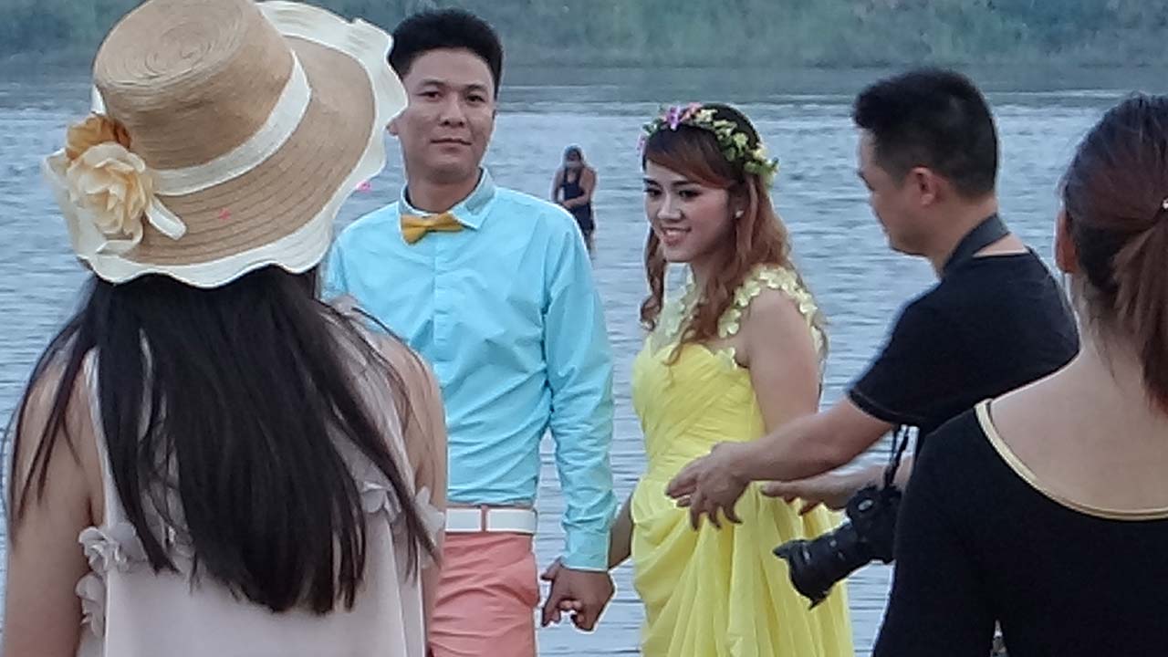 Couple pose on Mekong River