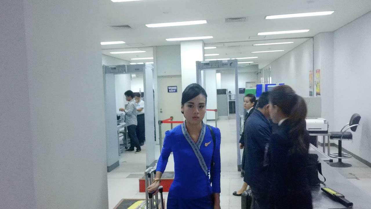 Flight Attendants In Airport on Flight To Bangkok