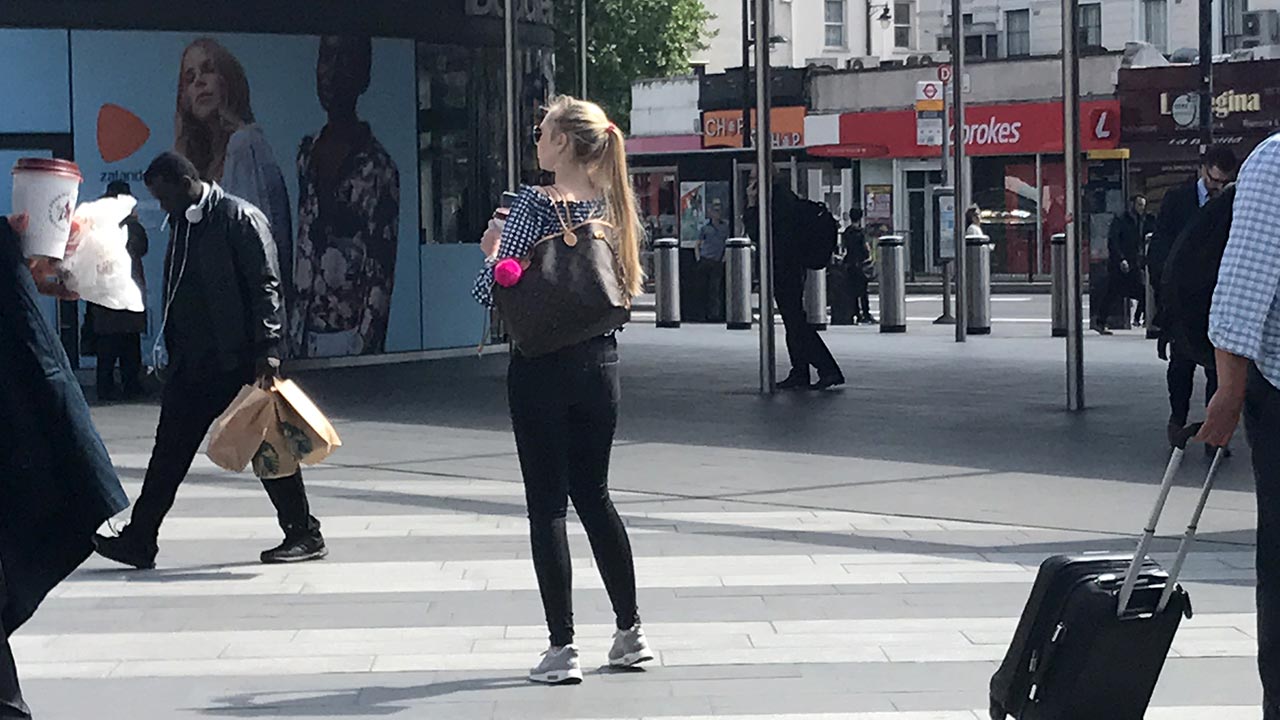 Blonde girl takes a walk on a beautiful day in London