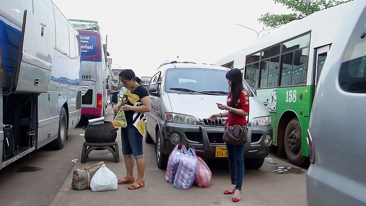 Girls waiting to board their Bus To Thailand