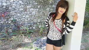 Horny Indo MILF depicted here in the photo outside, shows off her Sex Trick at hotel