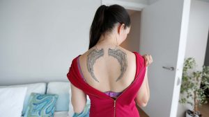 Slutty Girl Shows Off Back Tattoos