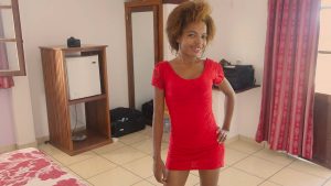 Horny African babe posing in short little red dress
