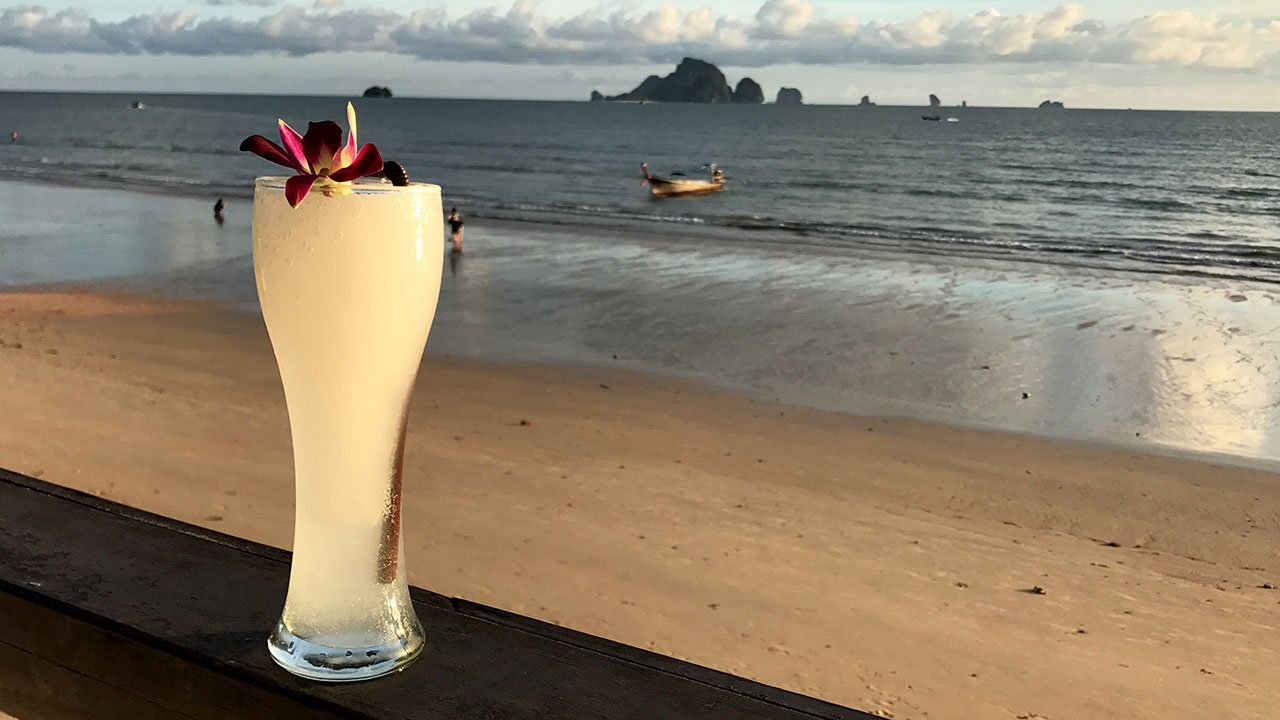 Nice view of Krabi Sunset at beach with a drink