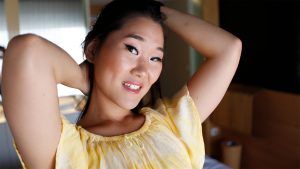 Chinese Teen poses in hotel room