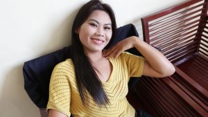 Cute Asian with big smile poses