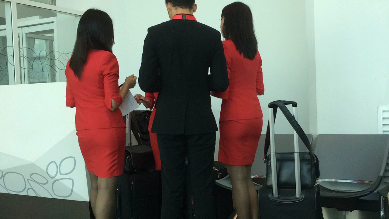 My arrival in Hong Kong was met with these sexy legs in stocking and short skirts
