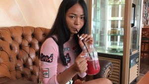 Jureka Del Mar sipping drink