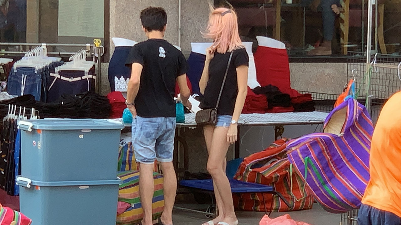 Spotted thin pink-haired Asian girl on walk in Hat Yai