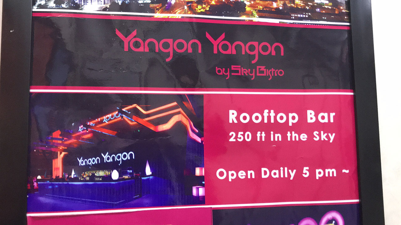 Yangon Yangon Rooftop Bar poster outside the building