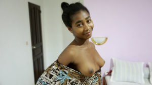 Perfect Black Teen girl with budding perky tits and virgin-like tight pussy flashing her breasts at camera