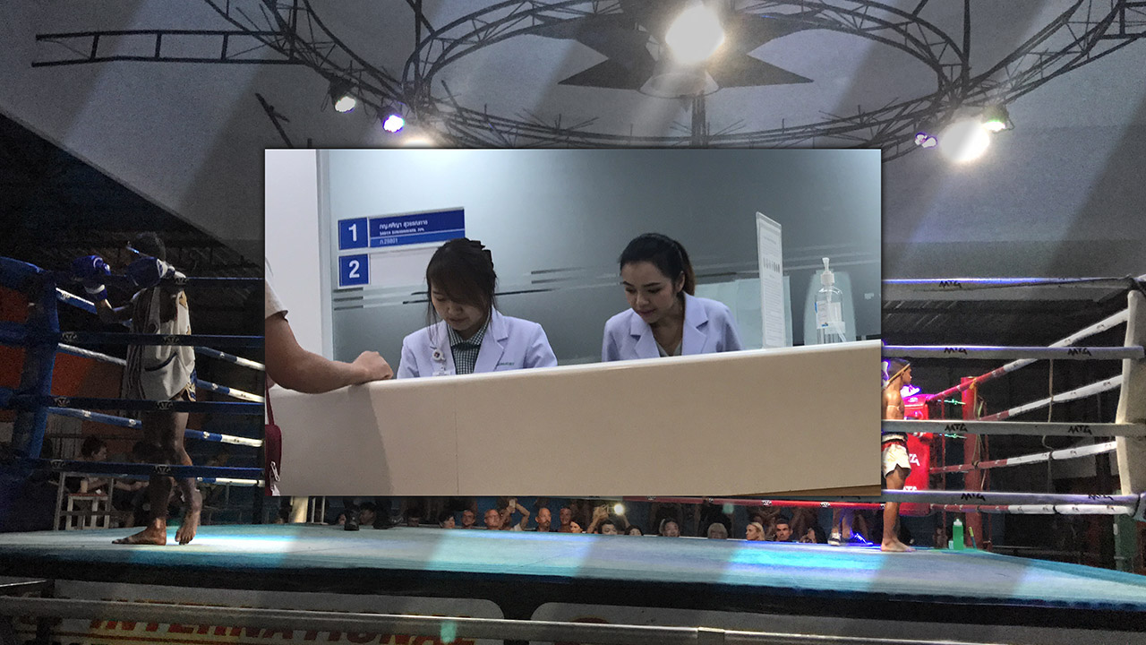 View inside local Thai Hospital at admissions counter and later on at boxing match