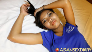 Cute Asian Models pretty face laying flat on bed