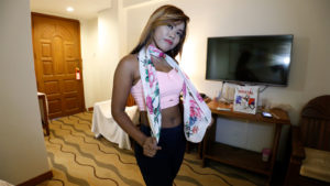 Asian babe poses in belly top