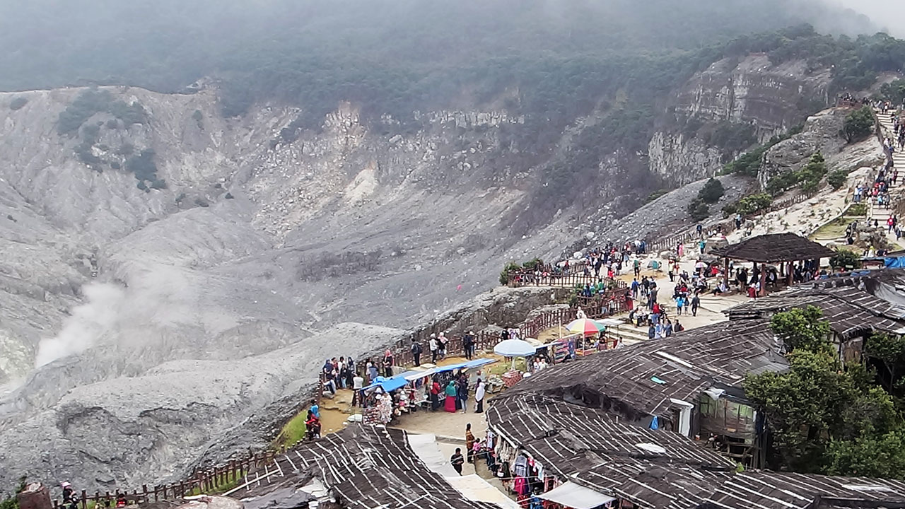 View of shops and sea of people at edge of Indonesia's Bandung Crater