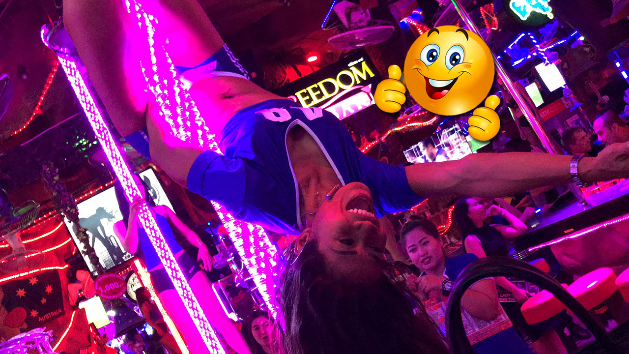 Stage dancer upside down on stripper pole at one of the Phuket Beerbars I visited