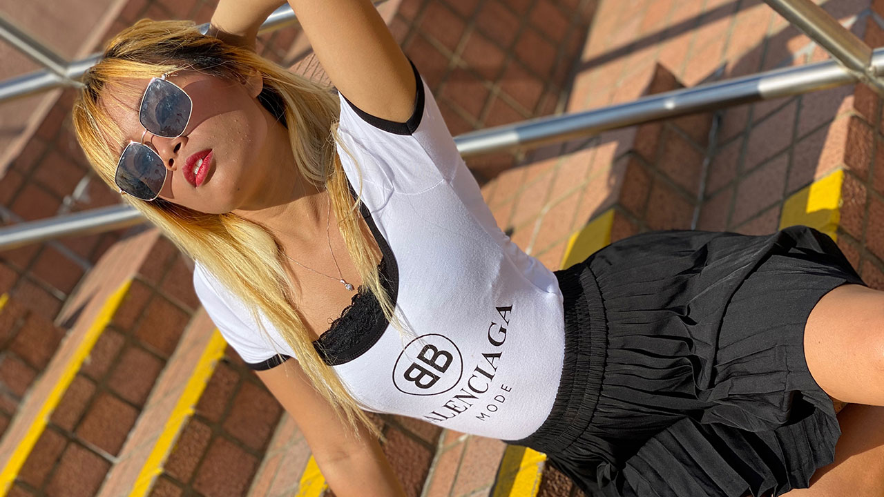 Sexy blonde Asian sitting on steps on Hong Kong with Filipina Upskirt panty pussy visible