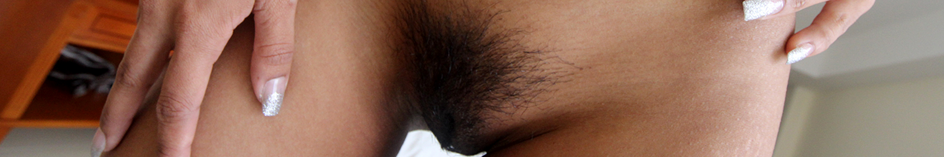 Closeup view of SMALL TITS HAIRY PUSSY mound with soft skin and dark Asian hair