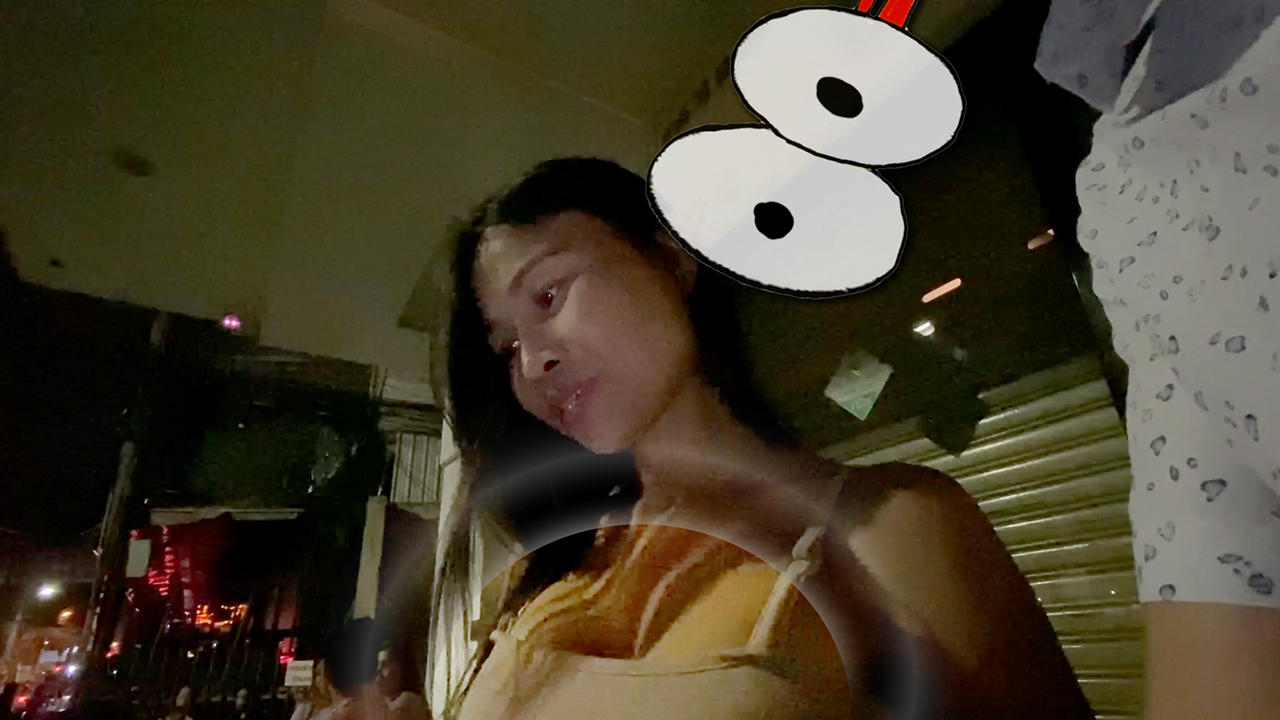 Street girl with nice cleavage giving phone number at Nana Plaza