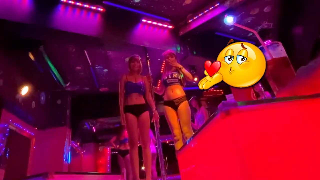 Girls blowing kisses from Patpong gogos stage