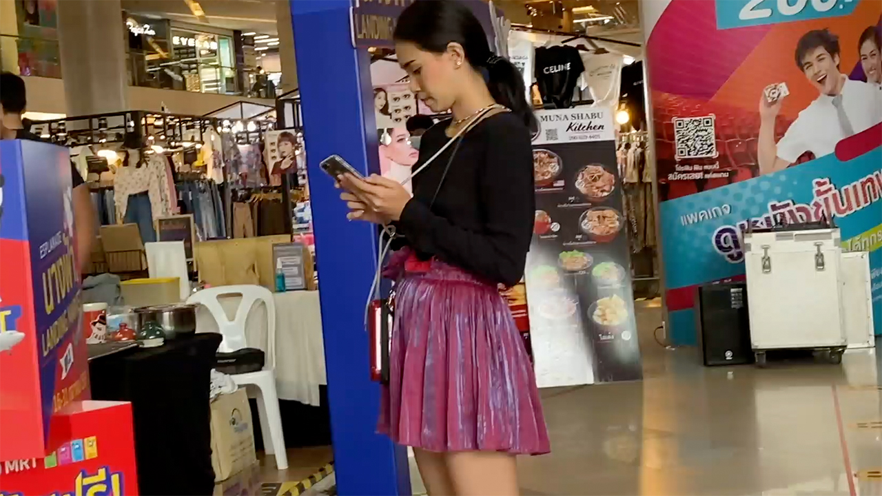 Cute girl in skirt Clothes Shopping In Bangkok mall