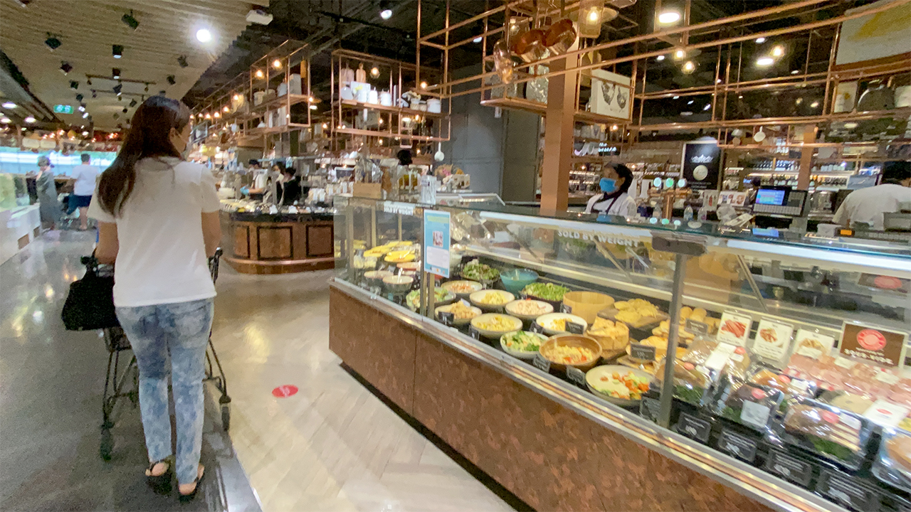 Cute Asian MILF in jeans browsing at Central Embassy Food Hall