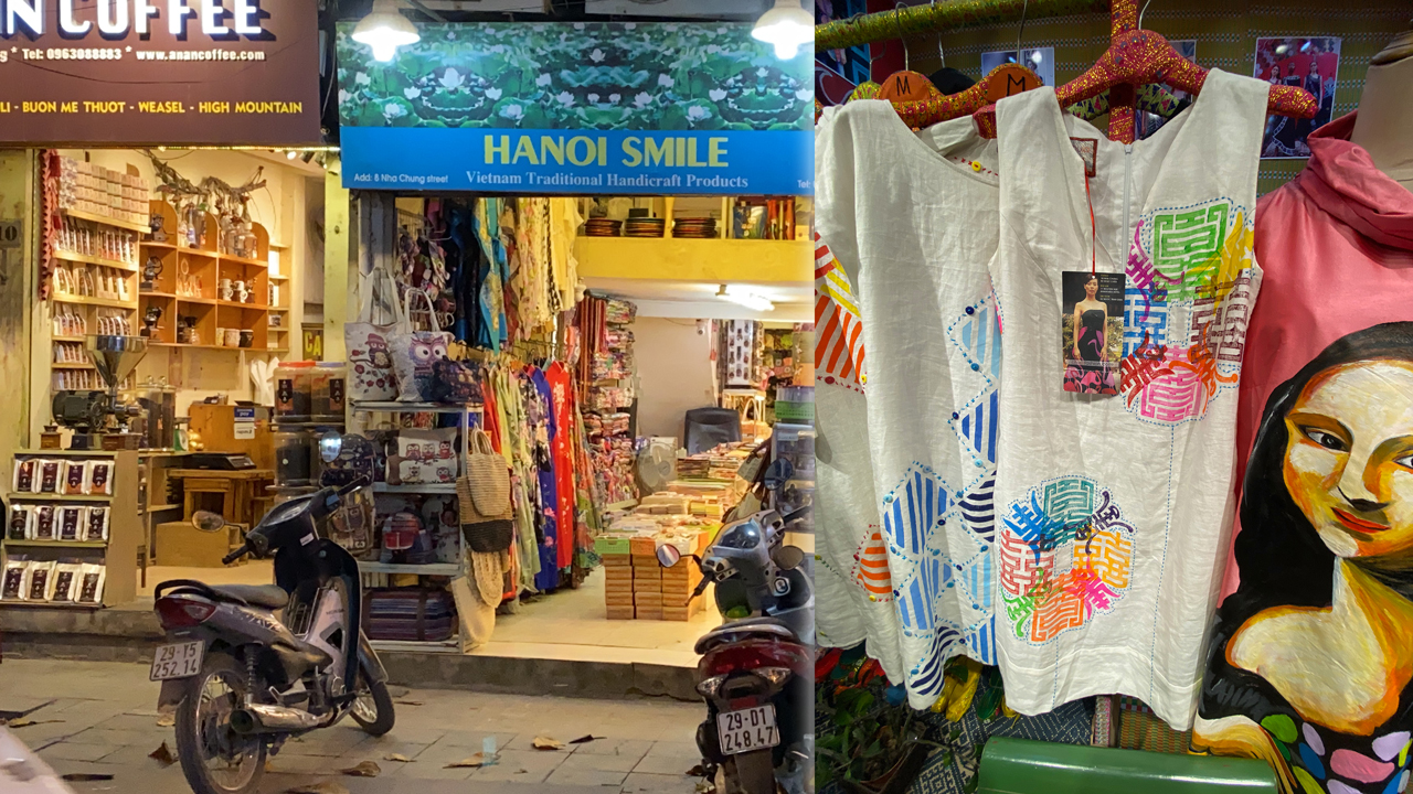 Mopeds parked outside Hanoi textile Market store fronts at night