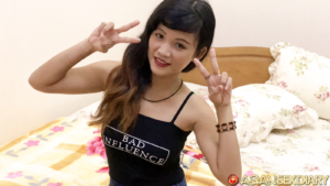 Excited Filipina dancer with peace signs