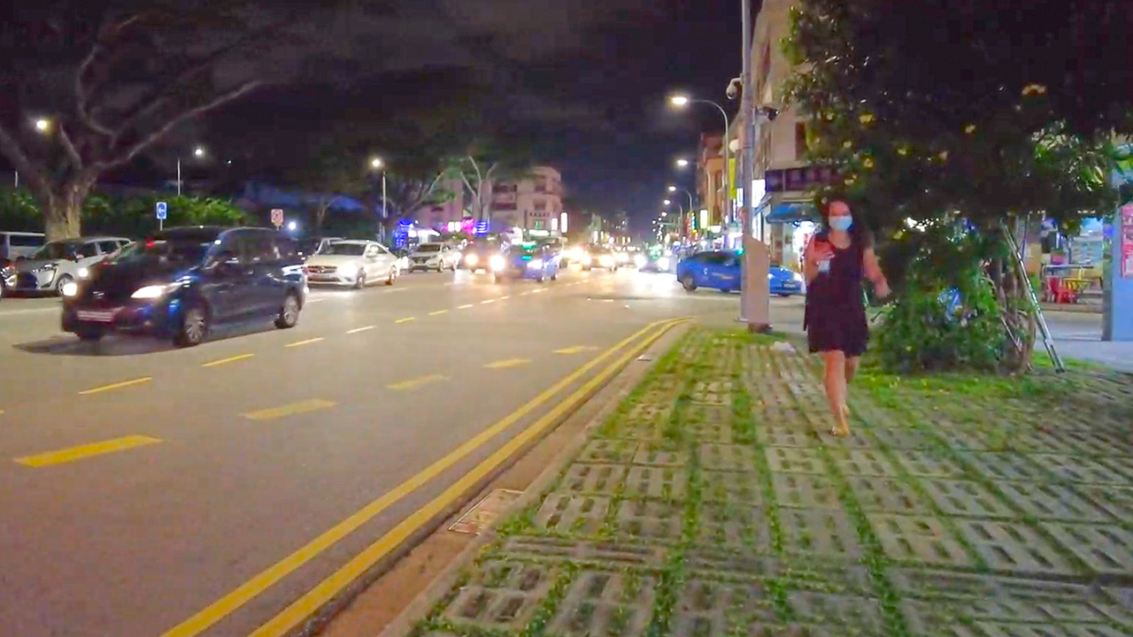 Singaporean girl walking during Geylang Singapore night time