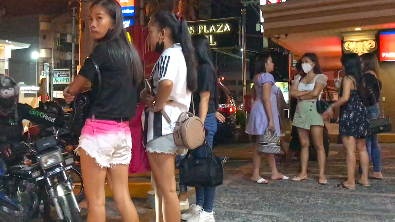 Angeles City Girls in short demin shorts on Walking Street at night