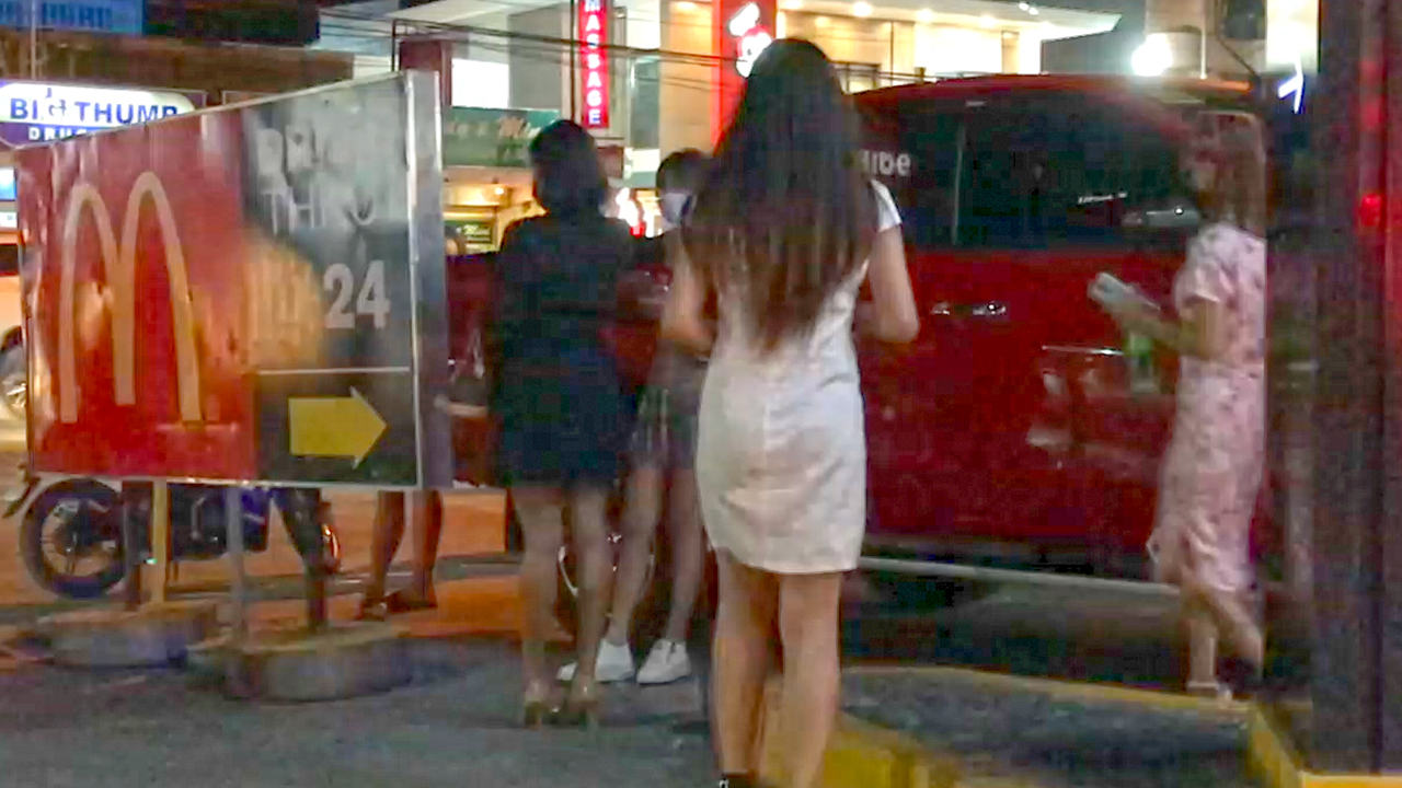 Filipina cute buns in short white dress from behind