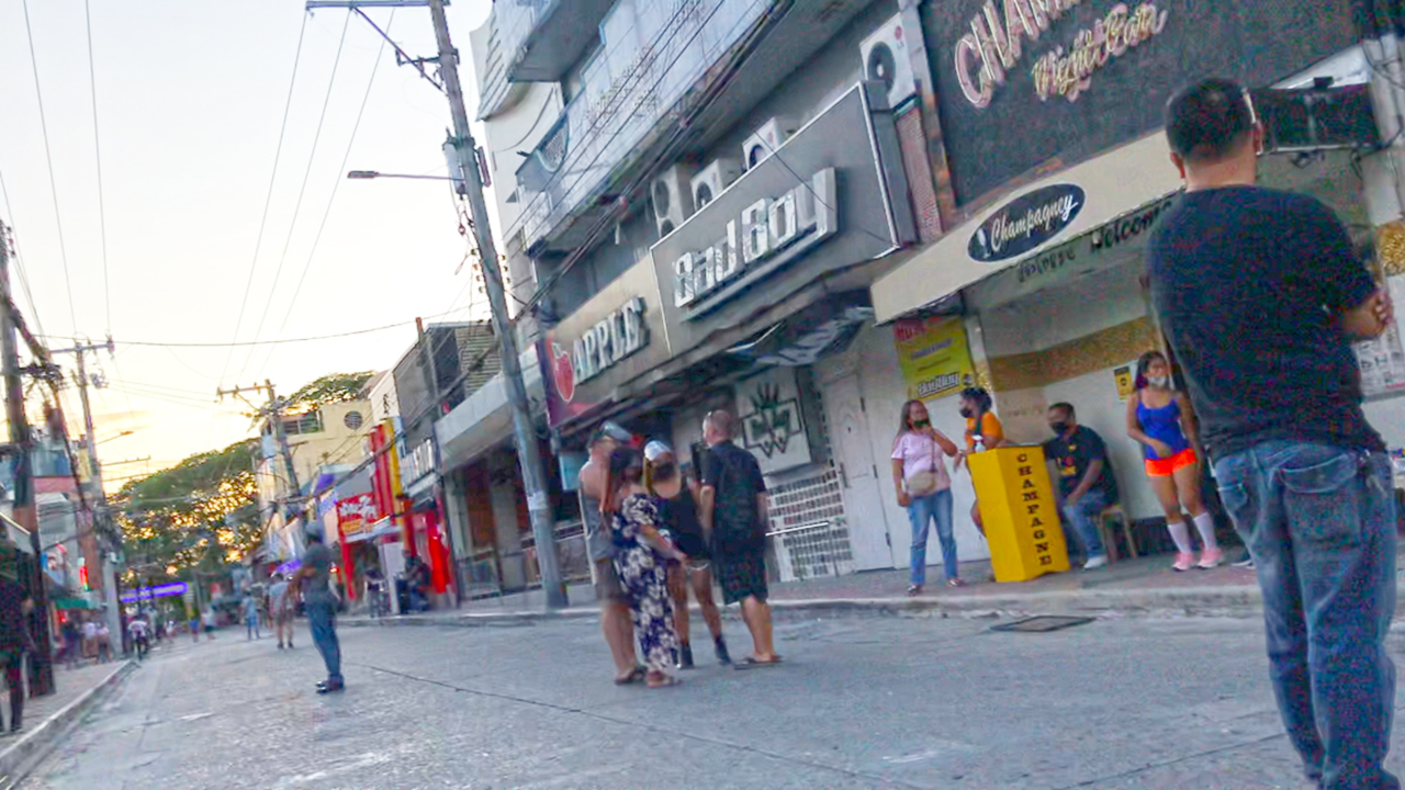 View of Filipina Girls and men on Fields Ave Walk