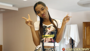 Making peace signs and kissy smile