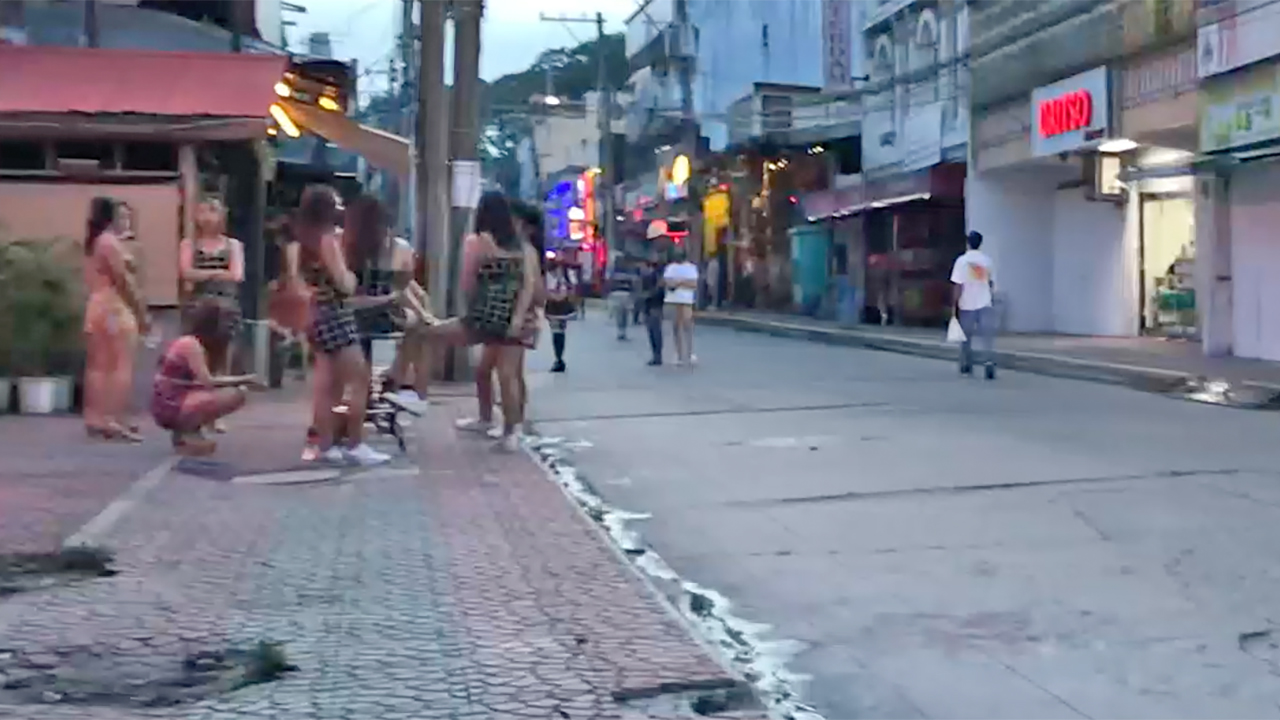 Real Street Sluts congregate together on sidewalk