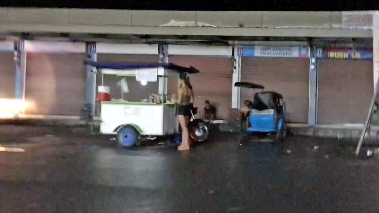 Street vendor in parking spot on the Streets After Midnight in Angeles City Philippines