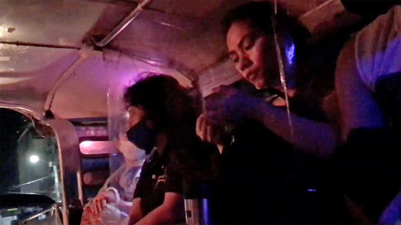 View of people inside Filipino Jeepney while on ride