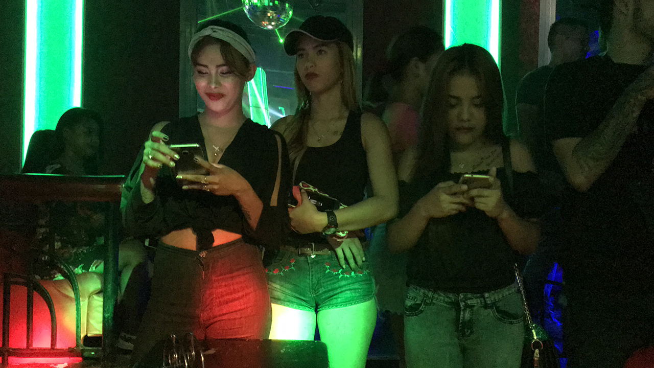 Filipina Girls texting at High Society Club Philippines