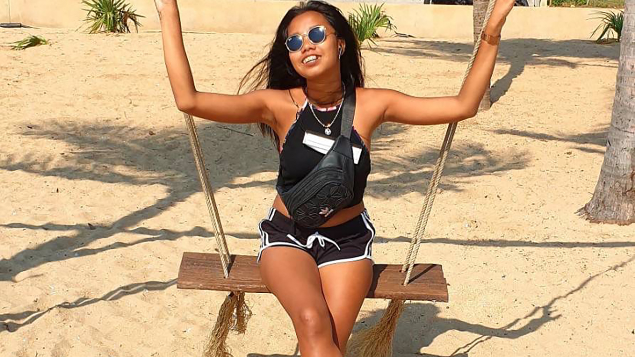 Sexy Asian Girl At Beach posing on swing set in shades