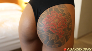 Closeup dark butt cheek with full cheek tattoo