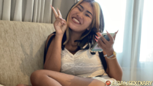 Happy Asian making peace sign