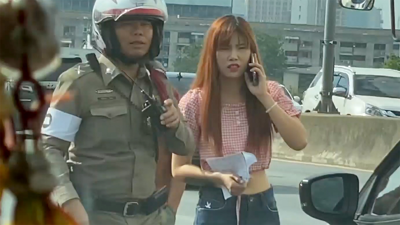 Thai Girl reporting accident on Drive To Bangkok