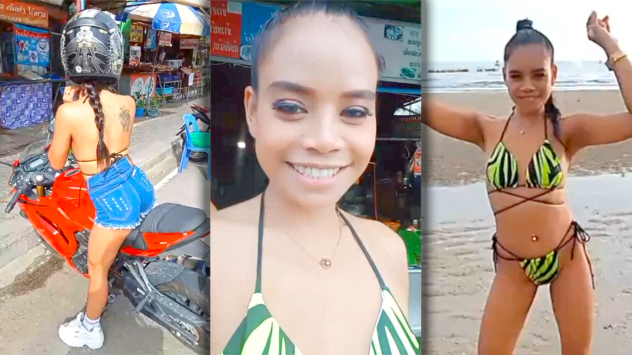Asian Biker Chick mounts motorcycle and poses at beach