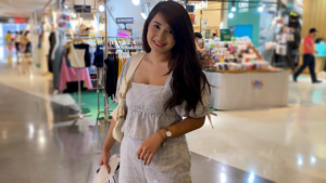 Pretty Asian Woman Jany poses in shopping mall