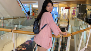 Horny Slut Jenny F poses in shorts and sweater at mall