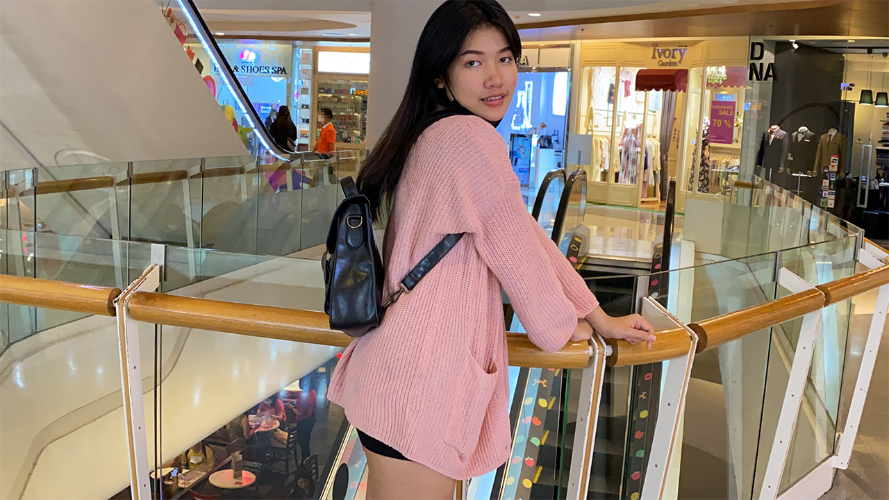 Horny Slut Jenny F poses in shorts and sweater at mall