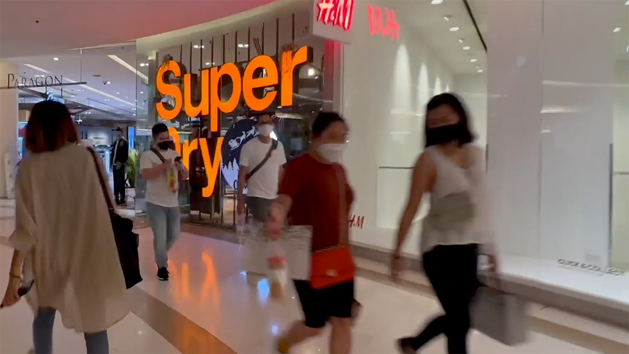 Thai girls walking down aisles in Bangkok Paragon Mall