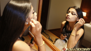 Sexy Myanmar girl does makeup in mirror