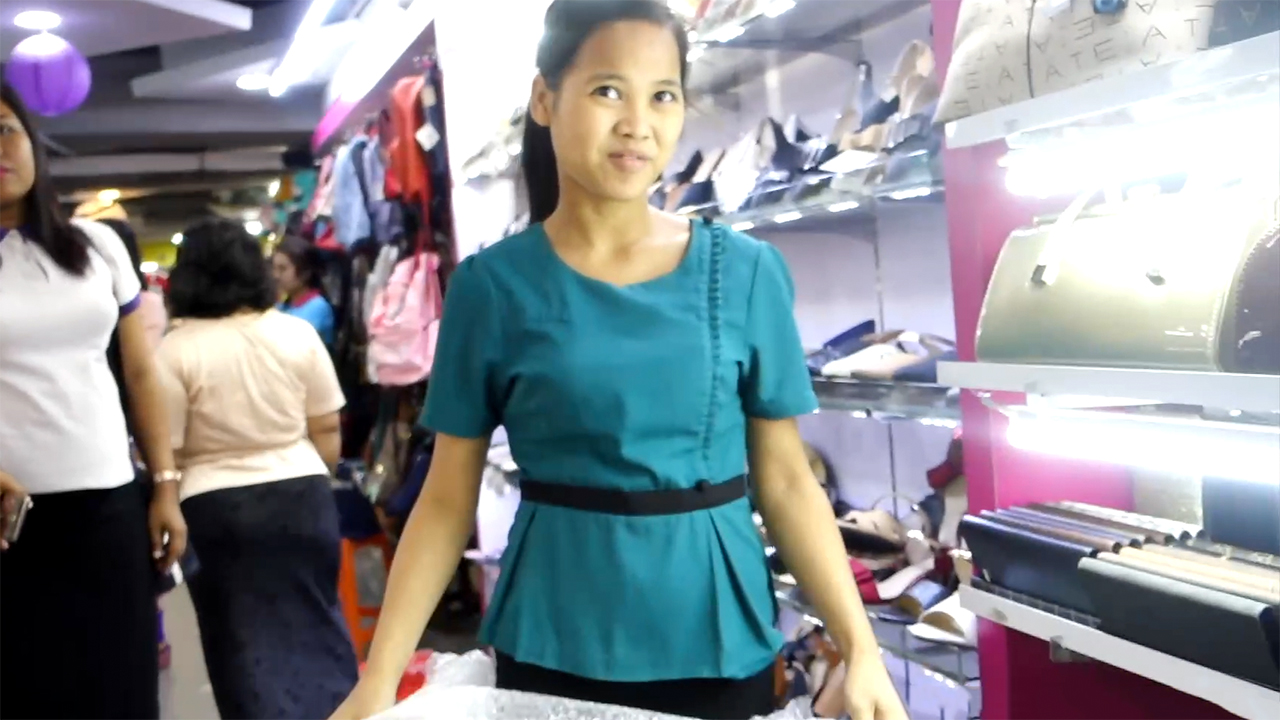 Burmese Beauty working little shop at the mall