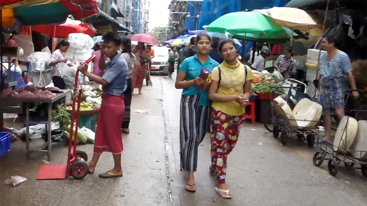 View of Myanmar Girls walking through Chinatown in Yangon